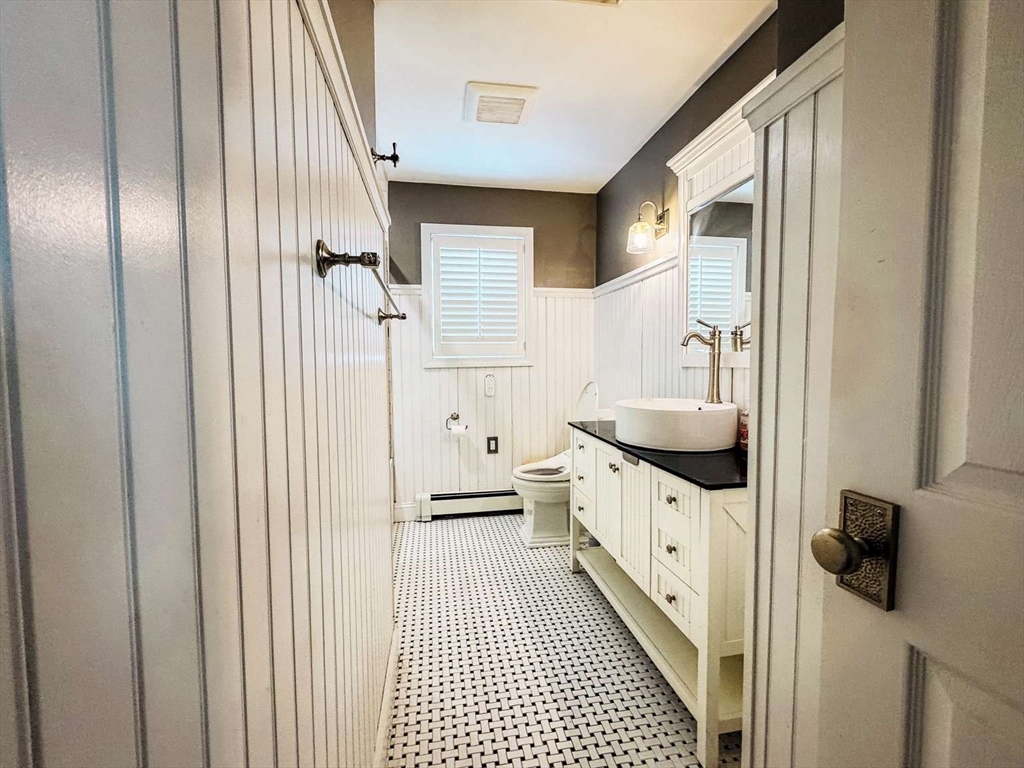 70 Brown Street Fall River, MA 02724 - Photo 11 of 31 a bathroom with a sink and a mirror