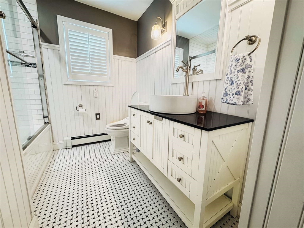 70 Brown Street Fall River, MA 02724 - Photo 12 of 31 a bathroom with a granite countertop sink a toilet and a shower