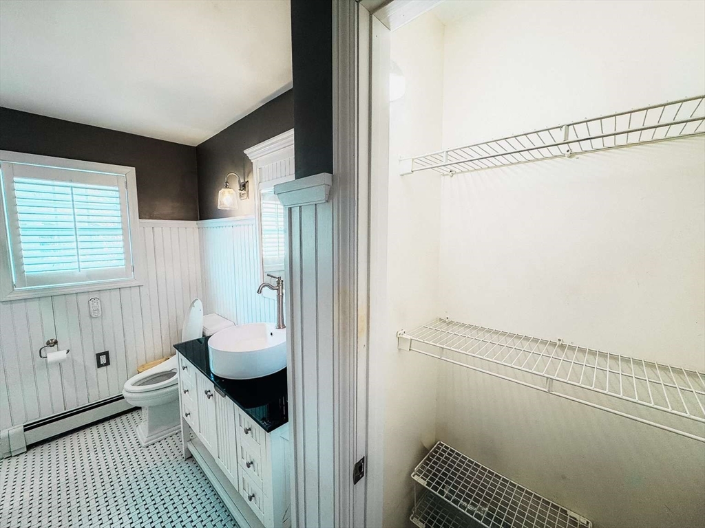 70 Brown Street Fall River, MA 02724 - Photo 13 of 31 a bathroom with a sink and a mirror