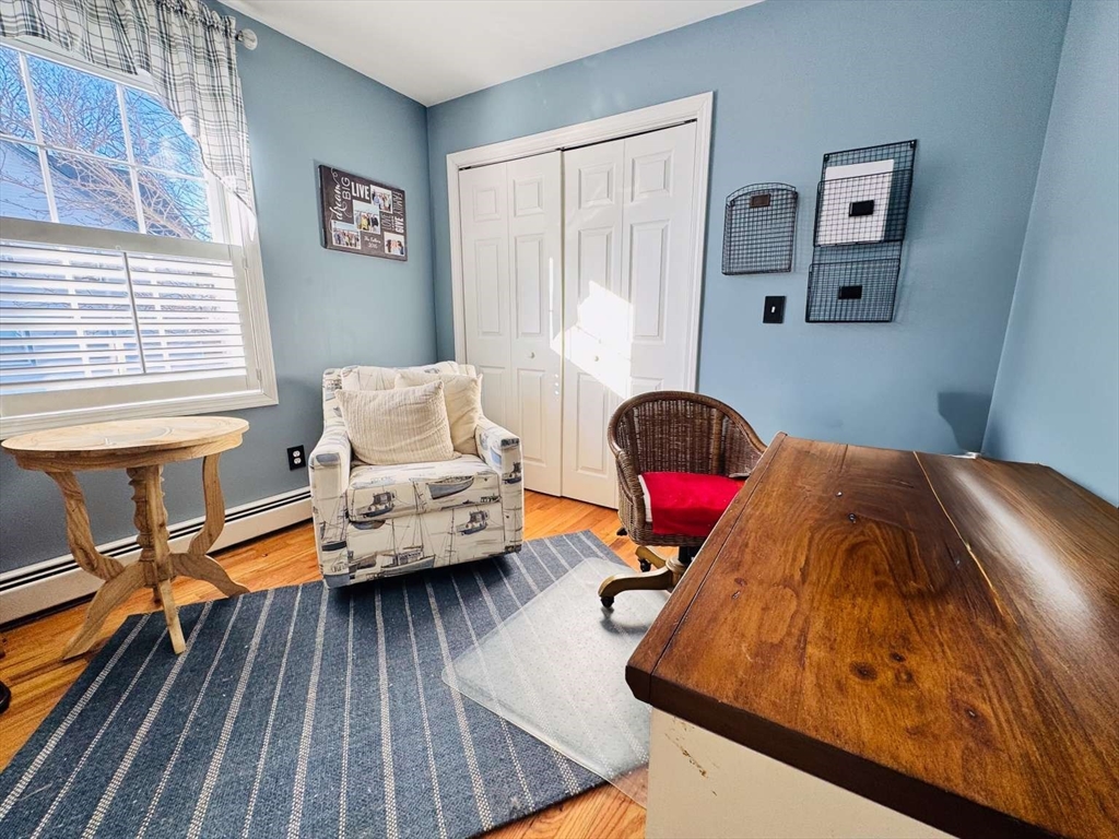 70 Brown Street Fall River, MA 02724 - Photo 20 of 31 a living room with furniture and a wooden floor