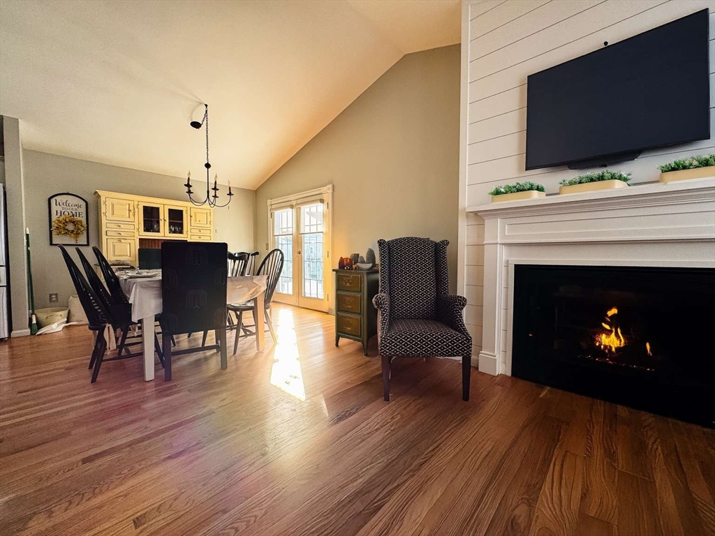 70 Brown Street Fall River, MA 02724 - Photo 5 of 31 a living room with furniture a fireplace and a flat screen tv
