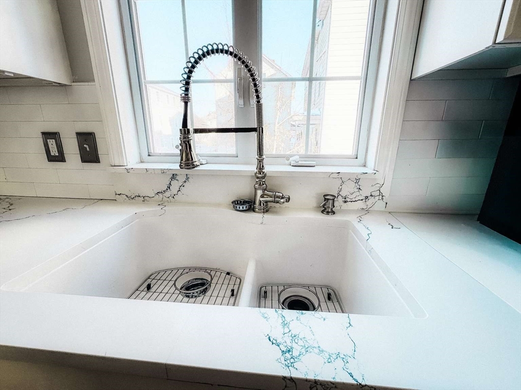70 Brown Street Fall River, MA 02724 - Photo 10 of 31 a bathroom with a sink and a window