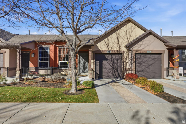 14820 175 East Draper, UT 84020 - Photo 1 of 39 View of front facade featuring driveway, stucco siding, roof with shingles, a garage, and covered porch