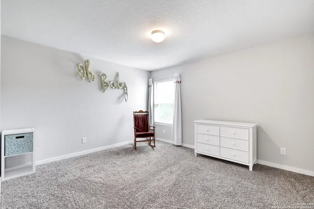 a view of room with hardwood wall and window