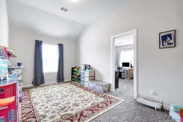 a bedroom with a bed and a table in it