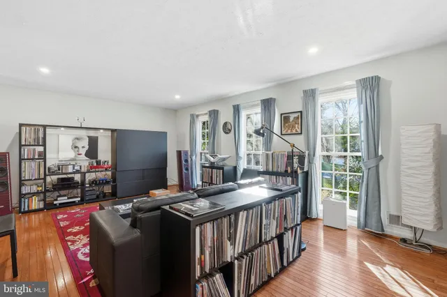 a room with furniture pool table and flat screen tv