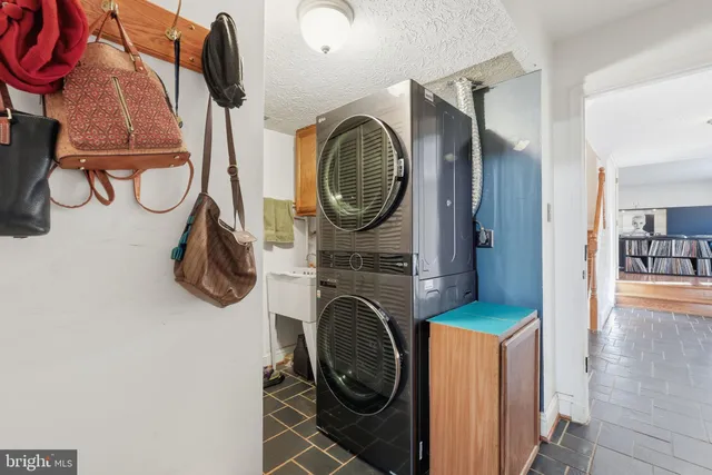 a view of a hallway with wooden floor and stairs