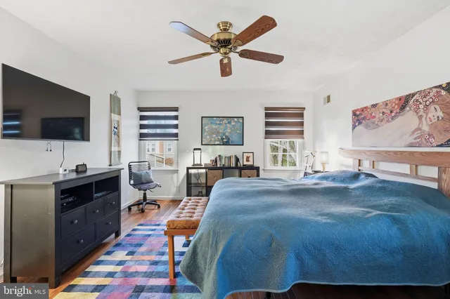 a spacious bathroom with a glass shower door and a mirror