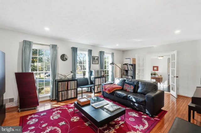 a living room with furniture rug and window