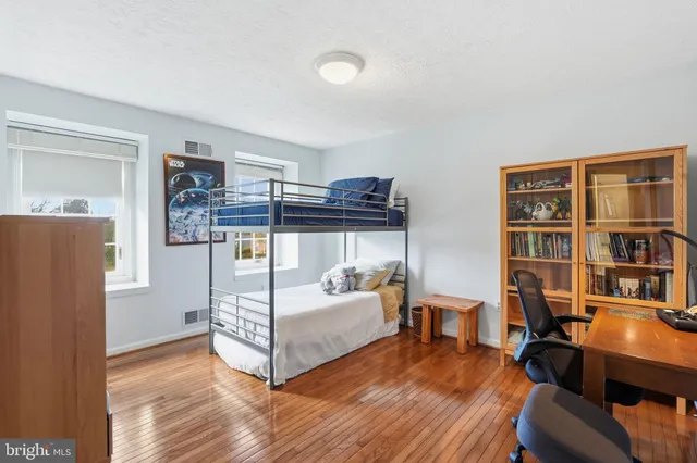 a living room with lots of furniture and a flat screen tv