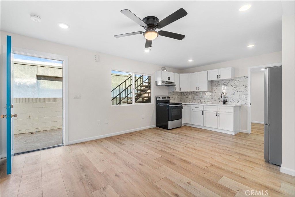 523 West 12th Street, Unit 5 San Pedro, CA 90731 - Photo 4 of 14 a view of kitchen with wooden floor