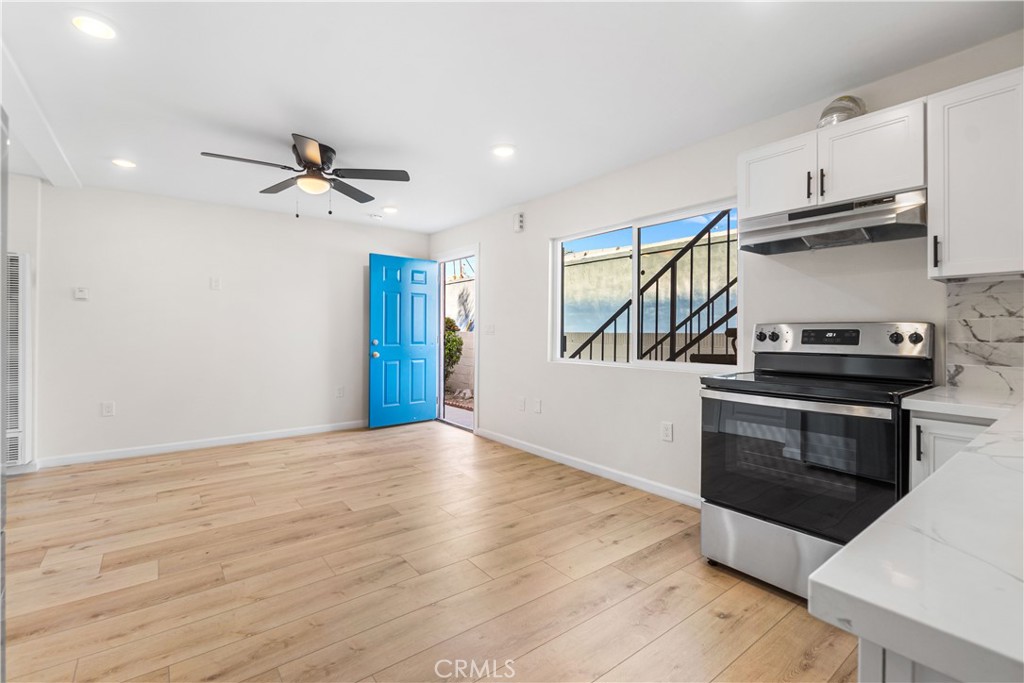 523 West 12th Street, Unit 5 San Pedro, CA 90731 - Photo 6 of 14 a kitchen with stainless steel appliances a stove and a refrigerator