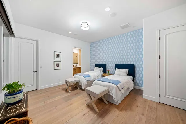 a bathroom with a double vanity sink mirror double and shower