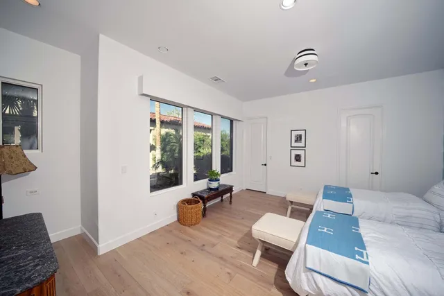 an aerial view of a house with a yard and garden