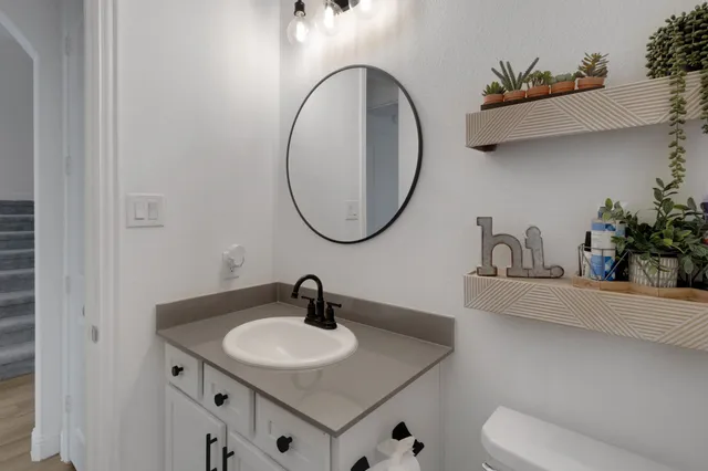 a bathroom with a sink and a mirror