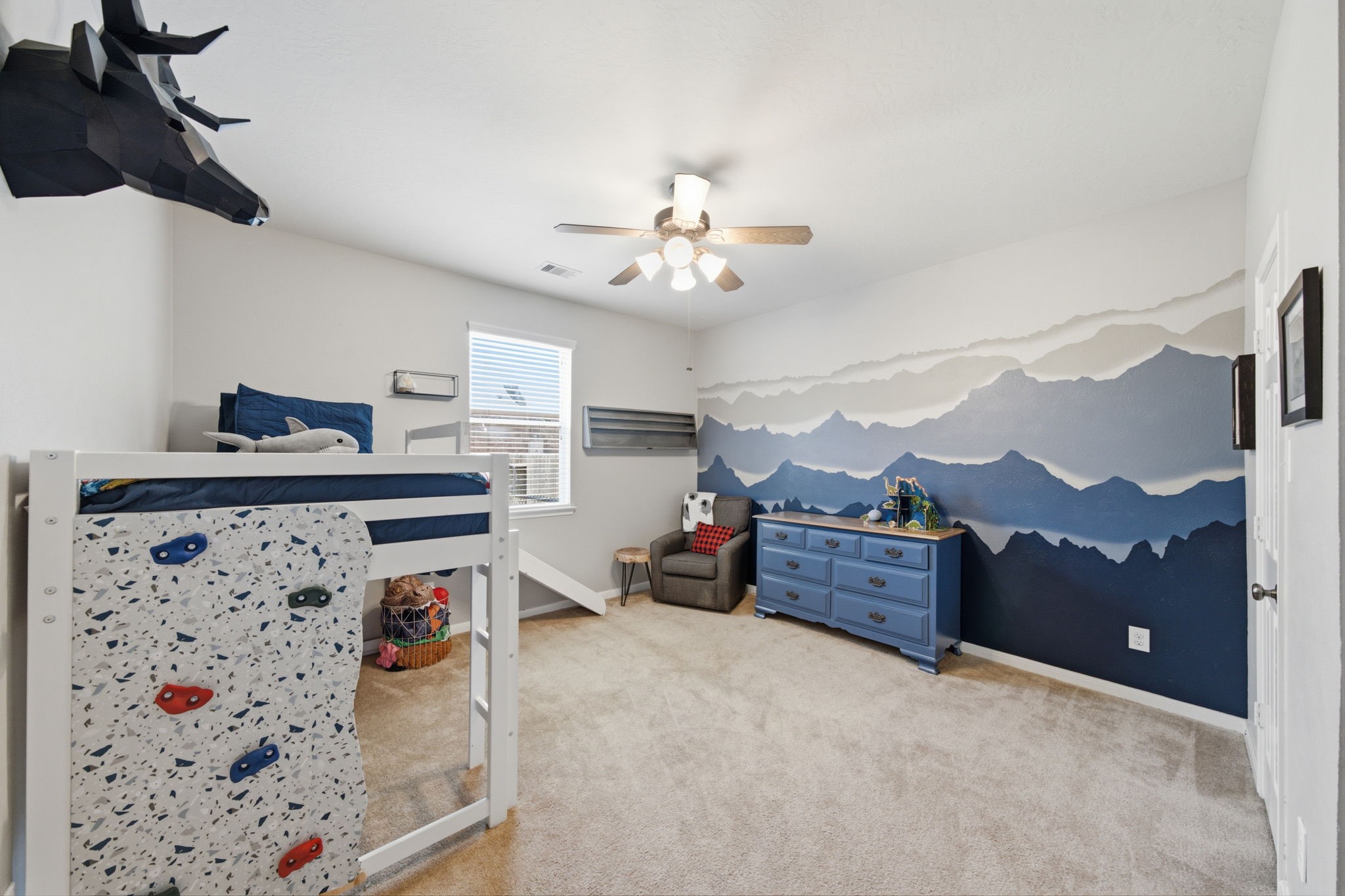 8911 Henrico Lane Rosenberg, TX 77469 - Photo 22 of 45 a bedroom with furniture and a chandelier fan