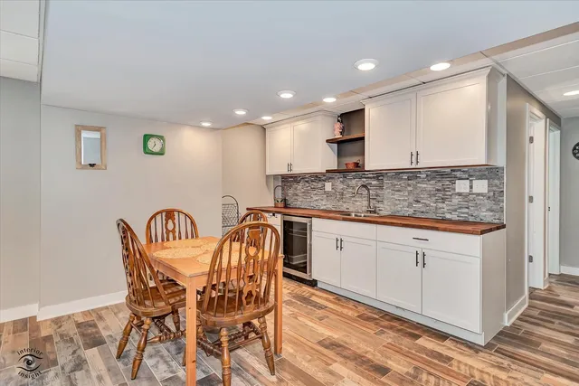 a kitchen with stainless steel appliances kitchen island granite countertop a sink and cabinets