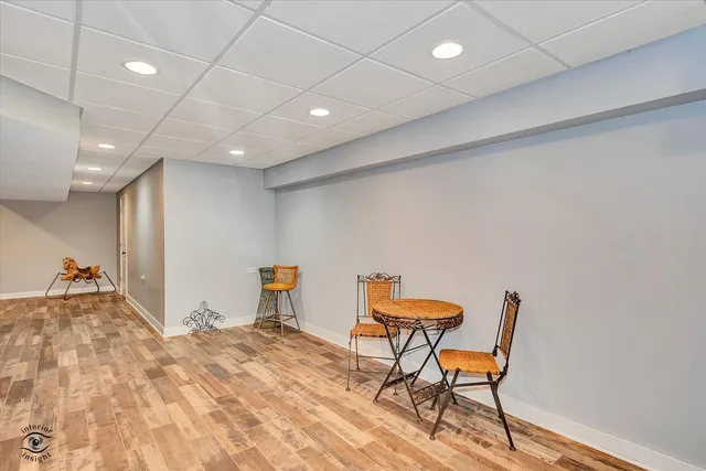a view of a room with furniture and a chandelier