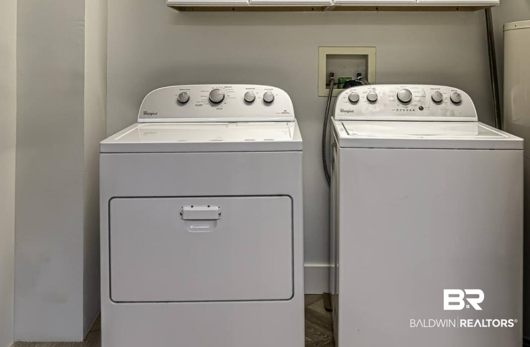 27800 Canal Road, Unit 212 Orange Beach, AL 36561 - Photo 34 of 43 Laundry room featuring washing machine and clothes dryer and laundry area