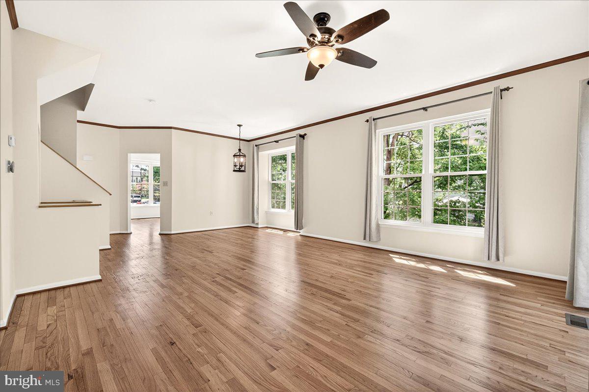 111 Water Land Way Frederick, MD 21702 - Photo 13 of 35 a view of an empty room with wooden floor and a window