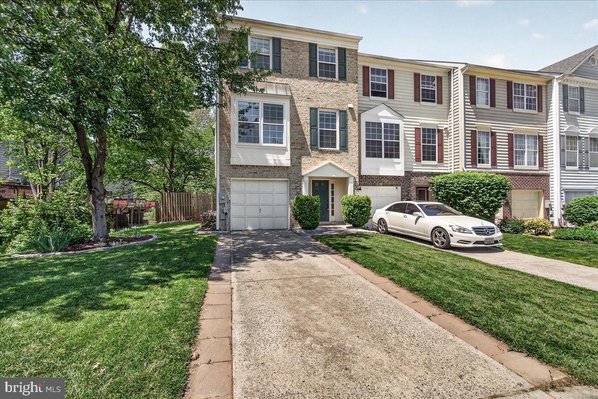 111 Water Land Way Frederick, MD 21702 - Photo 2 of 35 a front view of a house with a garden and porch