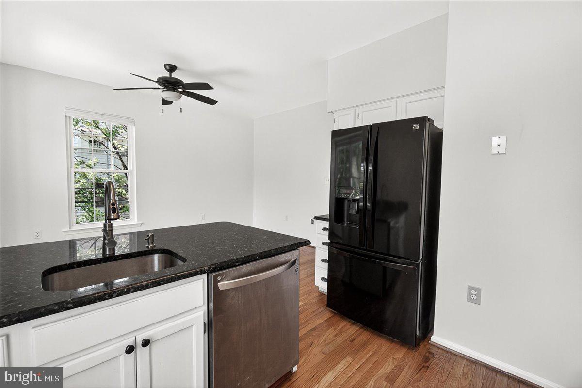 111 Water Land Way Frederick, MD 21702 - Photo 22 of 35 a kitchen with a refrigerator and a sink