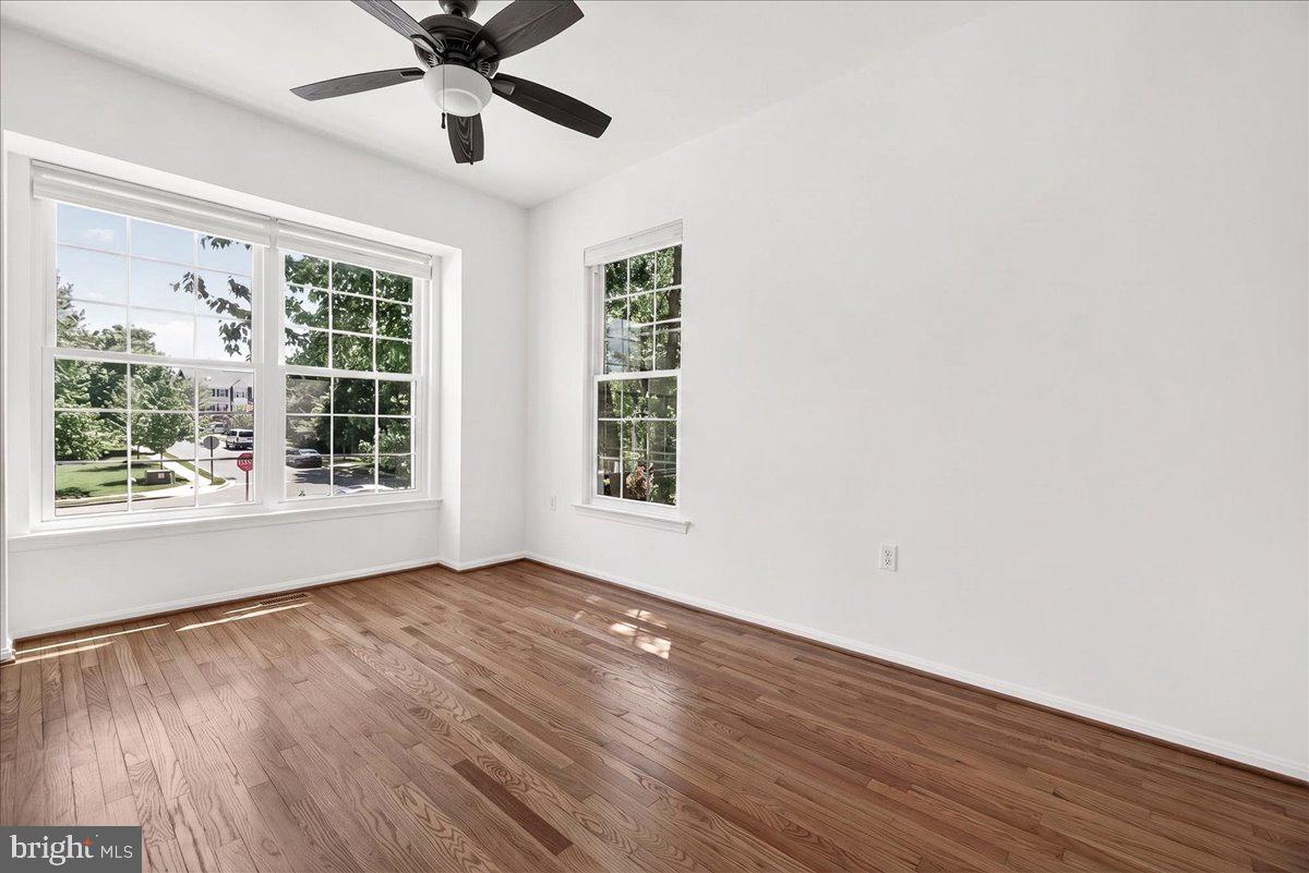 111 Water Land Way Frederick, MD 21702 - Photo 24 of 35 a view of an empty room with wooden floor and a window