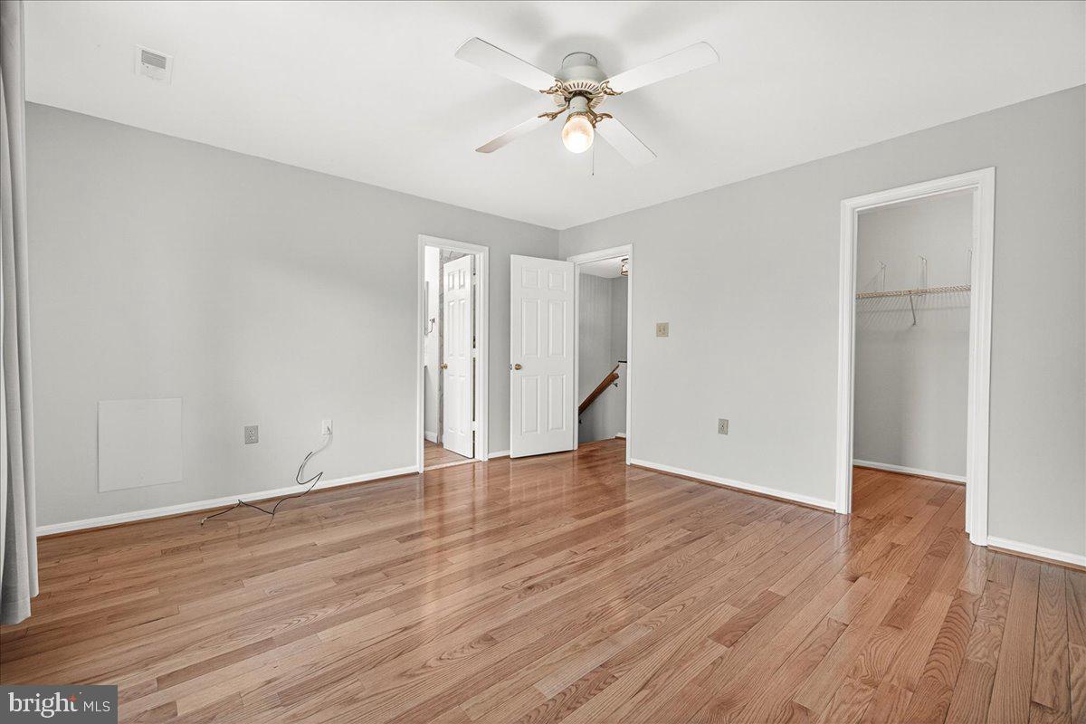 111 Water Land Way Frederick, MD 21702 - Photo 26 of 35 a view of an empty room with wooden floor