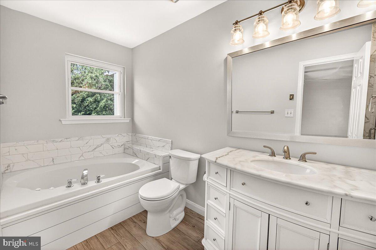 111 Water Land Way Frederick, MD 21702 - Photo 28 of 35 a bathroom with a sink a toilet and a bathtub