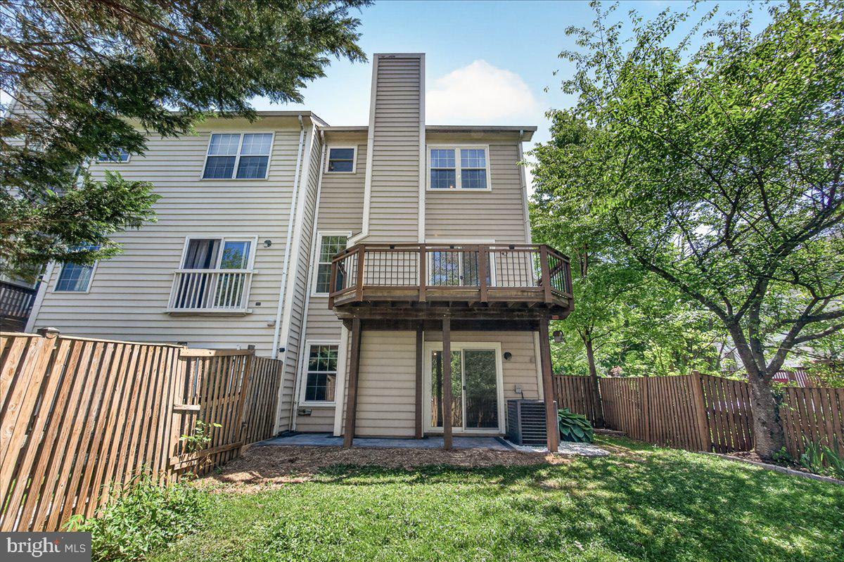 111 Water Land Way Frederick, MD 21702 - Photo 34 of 35 a view of a house with a yard and wooden fence