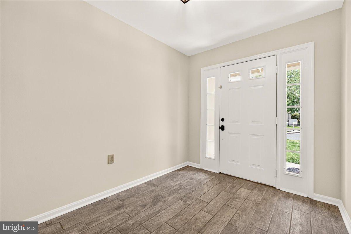 111 Water Land Way Frederick, MD 21702 - Photo 4 of 35 a view of an empty room with wooden floor
