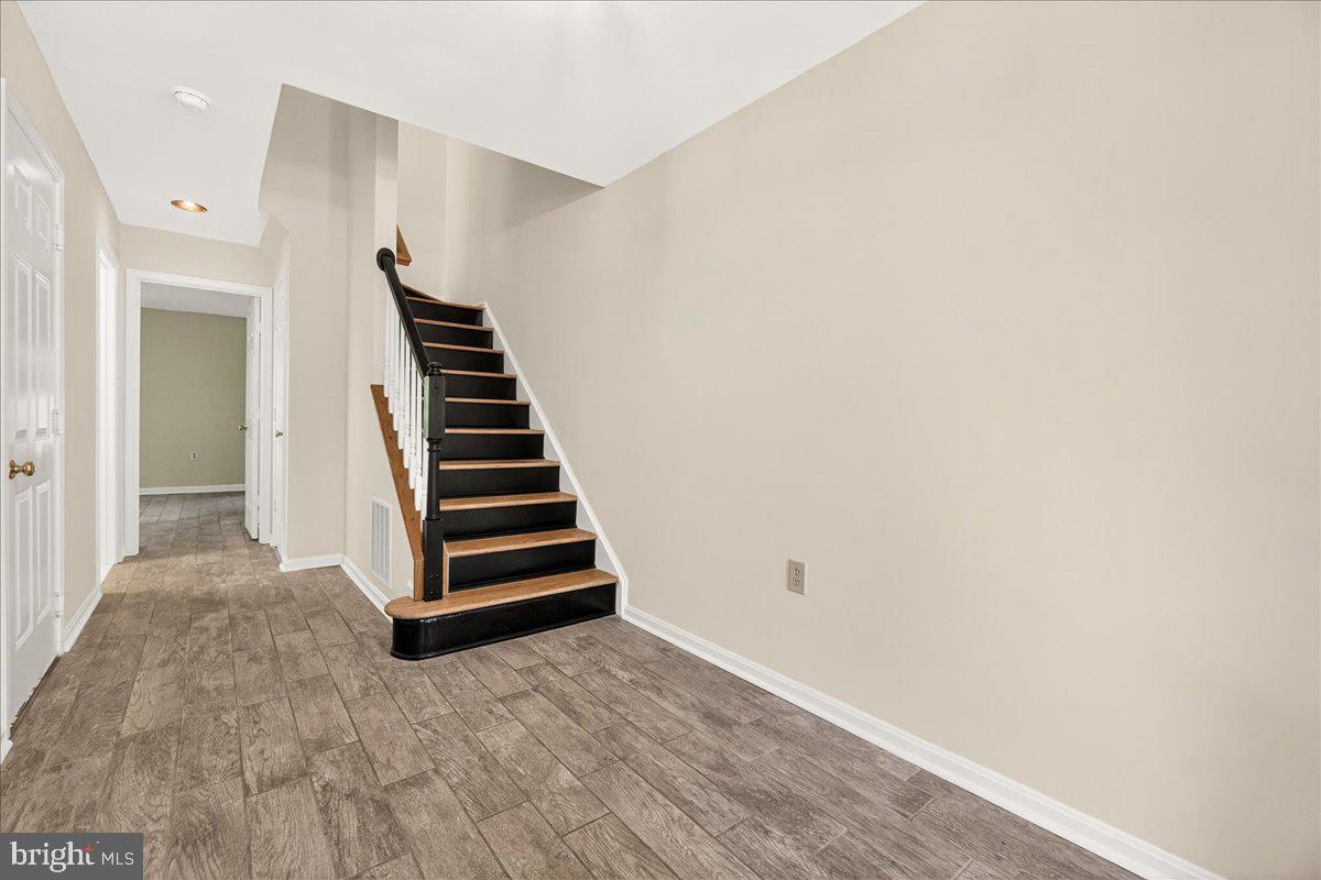111 Water Land Way Frederick, MD 21702 - Photo 5 of 35 a view of room with stairs and wooden floor