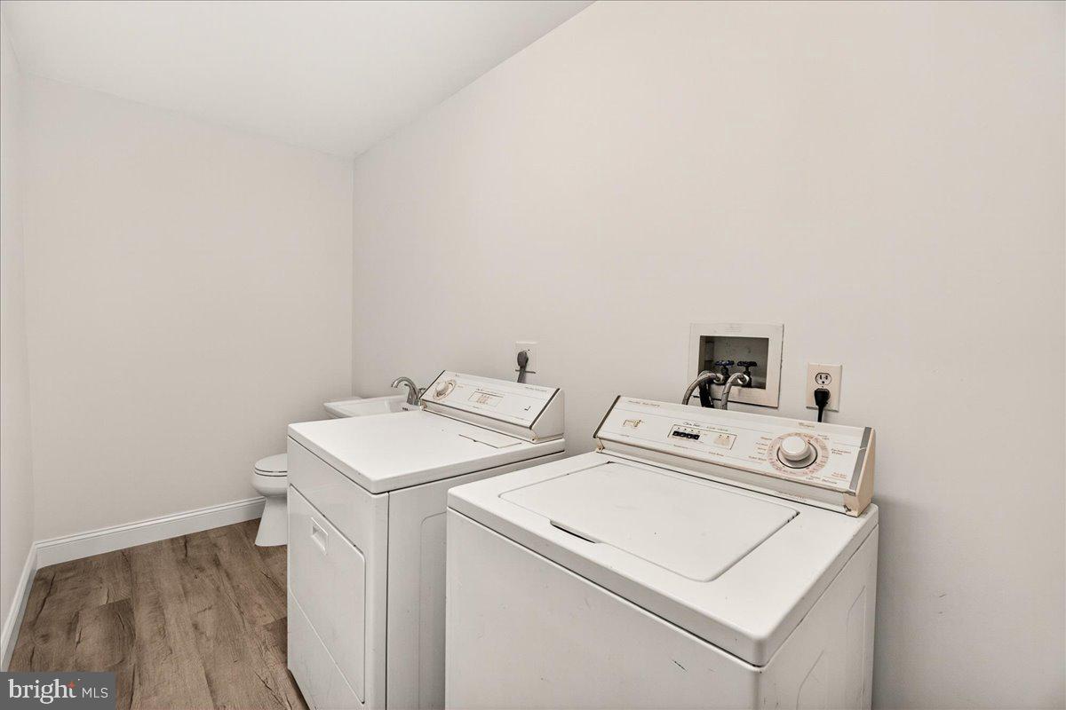111 Water Land Way Frederick, MD 21702 - Photo 8 of 35 a utility room with dryer and washer