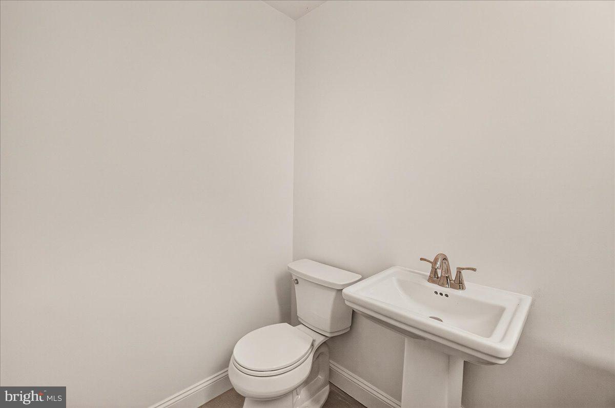 111 Water Land Way Frederick, MD 21702 - Photo 9 of 35 a white toilet sitting next to a white sink