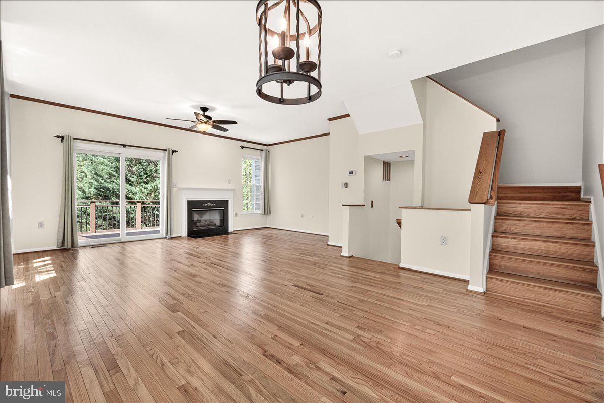 111 Water Land Way Frederick, MD 21702 - Photo 10 of 35 an empty room with wooden floor fan and windows