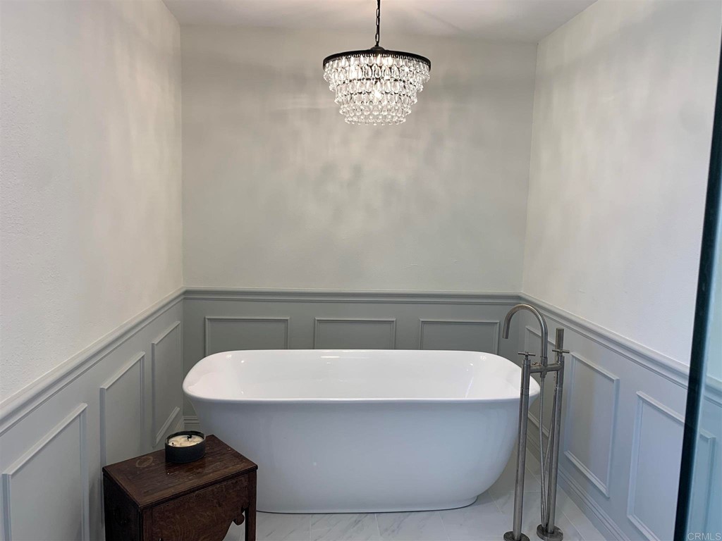 a bathroom with a sink and view of a mirror