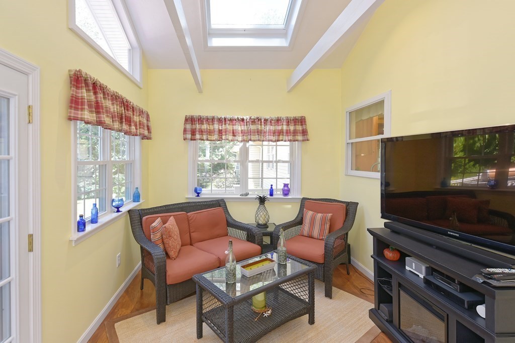 25 Edward Road Mendon, MA 01756 - Photo 15 of 42 a living room with furniture and a flat screen tv