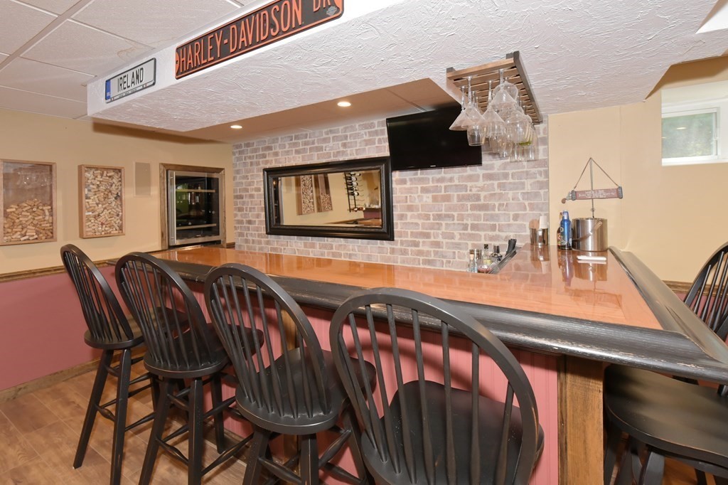 25 Edward Road Mendon, MA 01756 - Photo 32 of 42 a view of a dining room with furniture and wooden floor