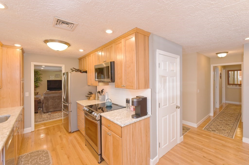 25 Edward Road Mendon, MA 01756 - Photo 7 of 42 a kitchen with a sink stove and refrigerator