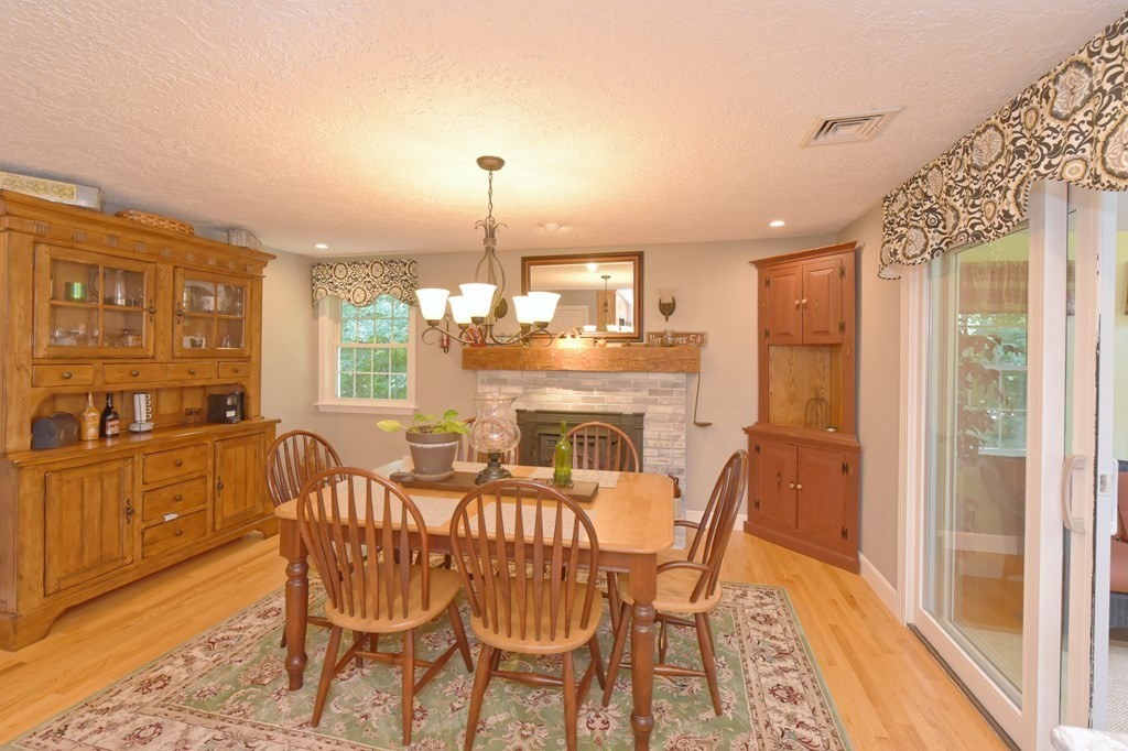 25 Edward Road Mendon, MA 01756 - Photo 8 of 42 a view of a dining room with furniture window and wooden floor