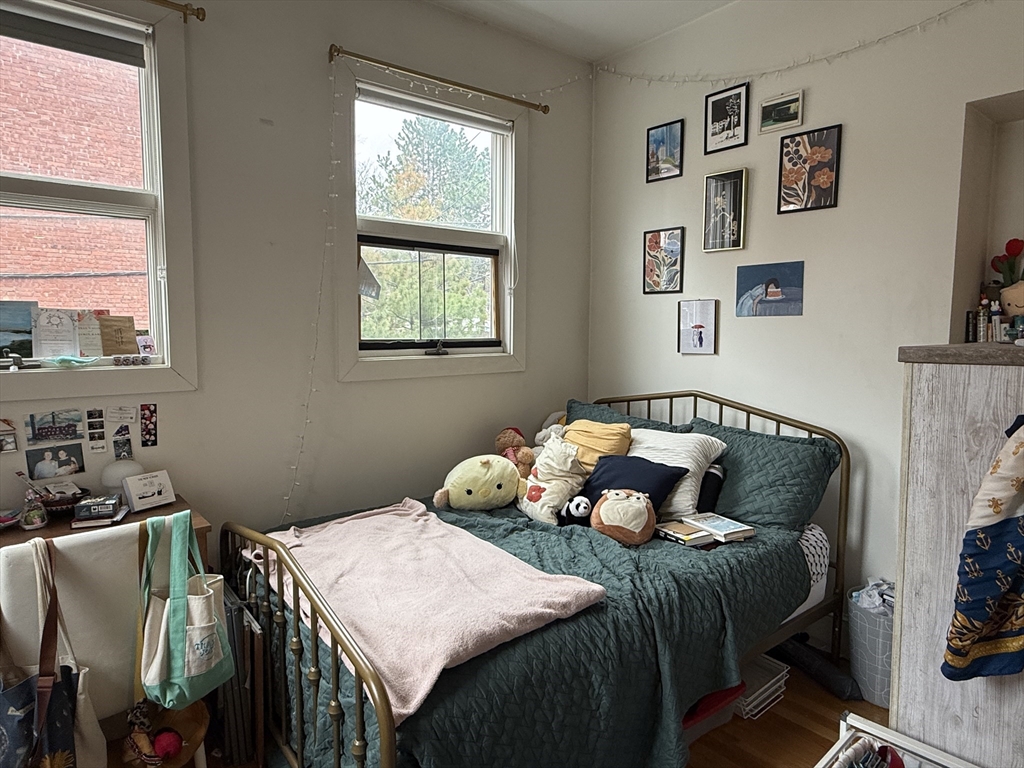 1871 Beacon Street, Unit 4 Brookline, MA 02445 - Photo 8 of 14 a bedroom with bed and a window