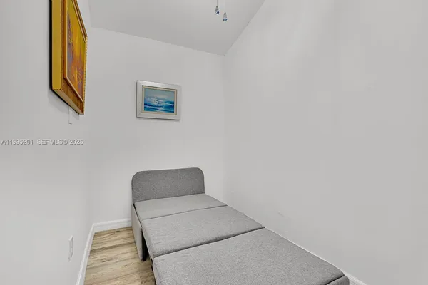 a bedroom with a bed and a chair