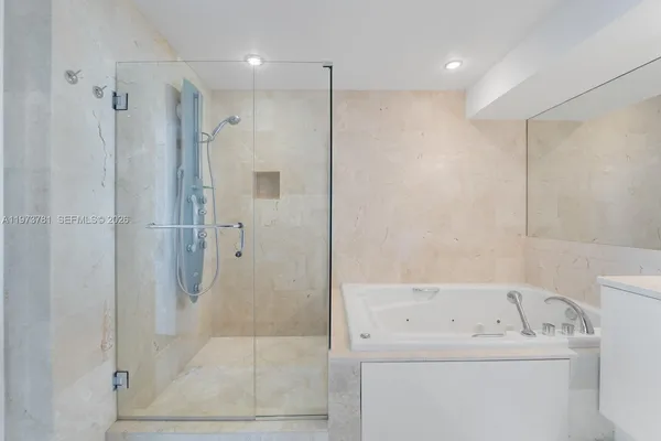 a bathroom with a bathtub and a sink