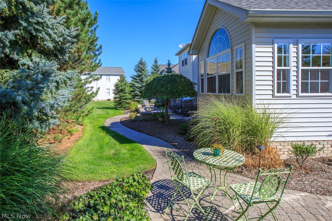 322 Burwick Road Cleveland, OH 44143 - Photo 21 of 25 The backyard is lovely with tall evergreens surrounding it to give you total privacy! The Landscaping is perfection!
