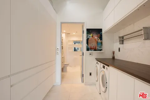 a bathroom with a granite countertop sink a mirror and shower