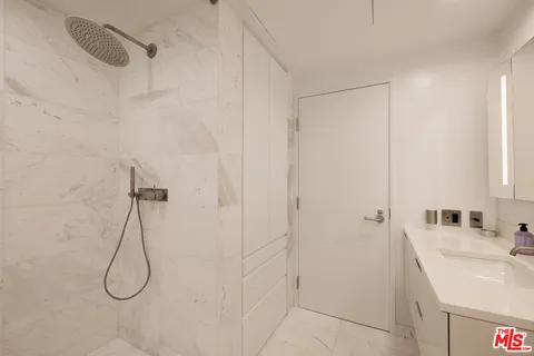 a bathroom with a sink and a shower
