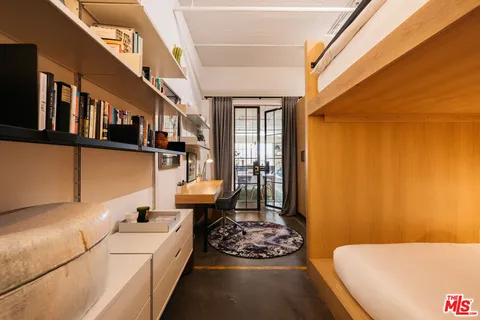a living room with furniture fireplace and a window