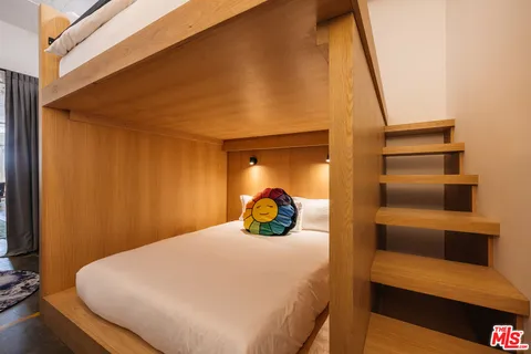 a bedroom with a bed and a cabinets