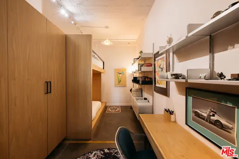a bathroom with a sink a mirror and shower
