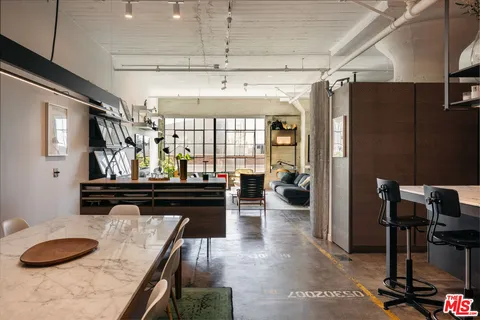 a kitchen with a refrigerator and countertop